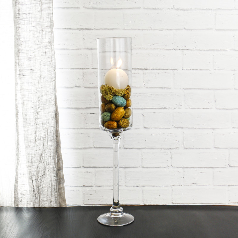 With a slightly more modern twist, you can add vase fillers and ball-shaped candles for an attractive modern home display 